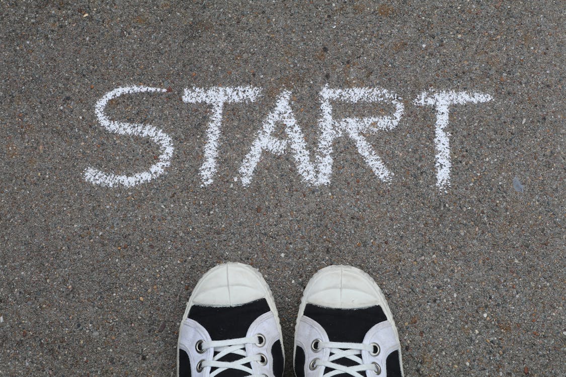 Free Start Written on Asphalt Stock Photo